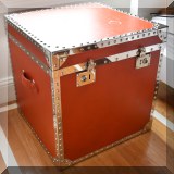 F33. Orange trunk side table. 24”h x 23”w x 23”d 